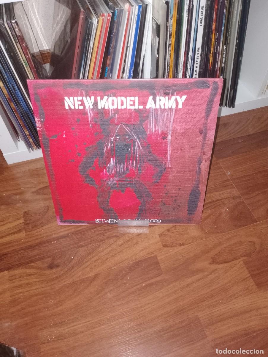 Discos de vinilo: new model army - between wine and blood