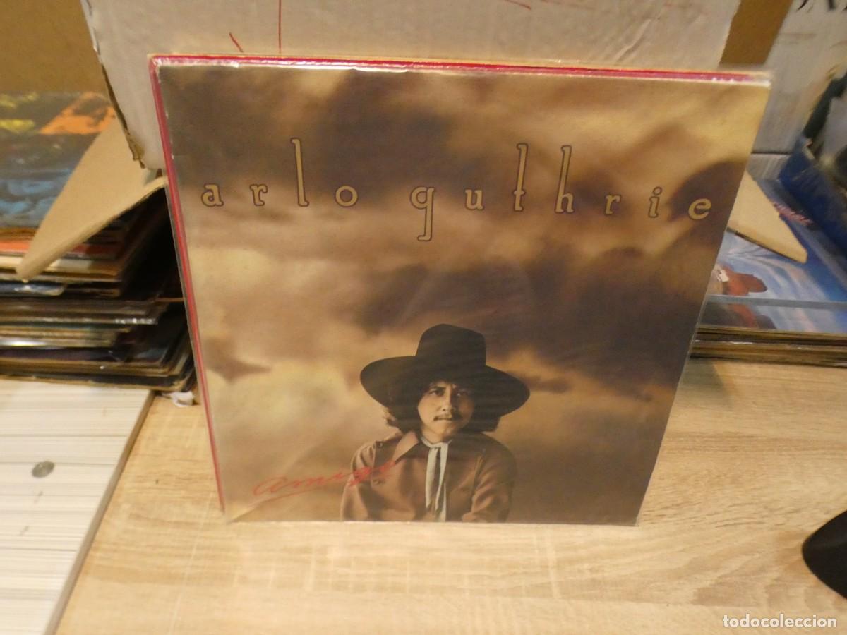 Discos de vinilo: ARKANSAS1980 CAJJ712 VINILO LEVES SE&Ntilde;ALES DE USO ARLO GUTHRIE