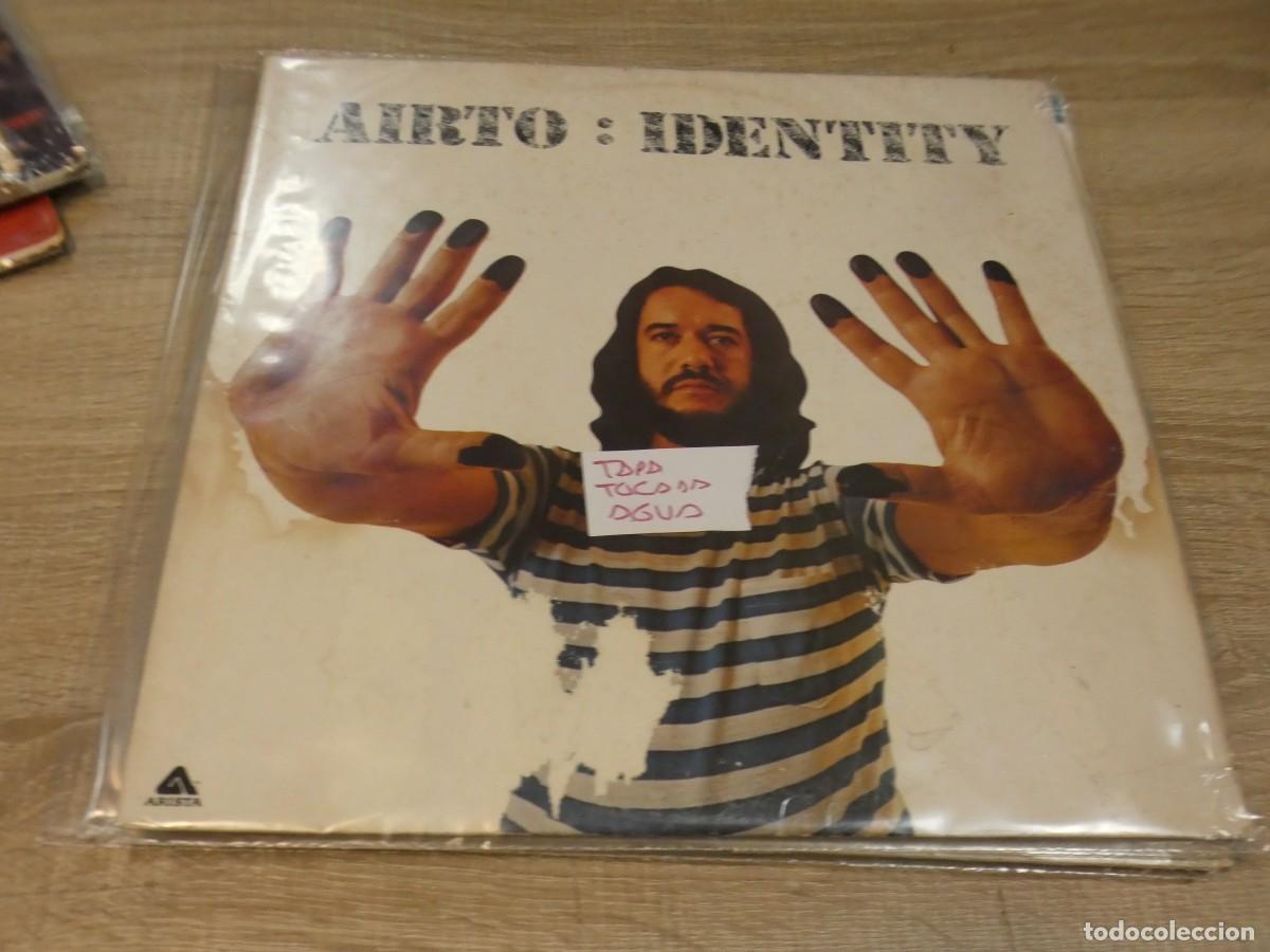 Discos de vinilo: ARKANSAS1980 LOTT720 VINILO LEVES SE&Ntilde;ALES DE USO AIRTO: IDENTITY TAPA TOCADA AGUA