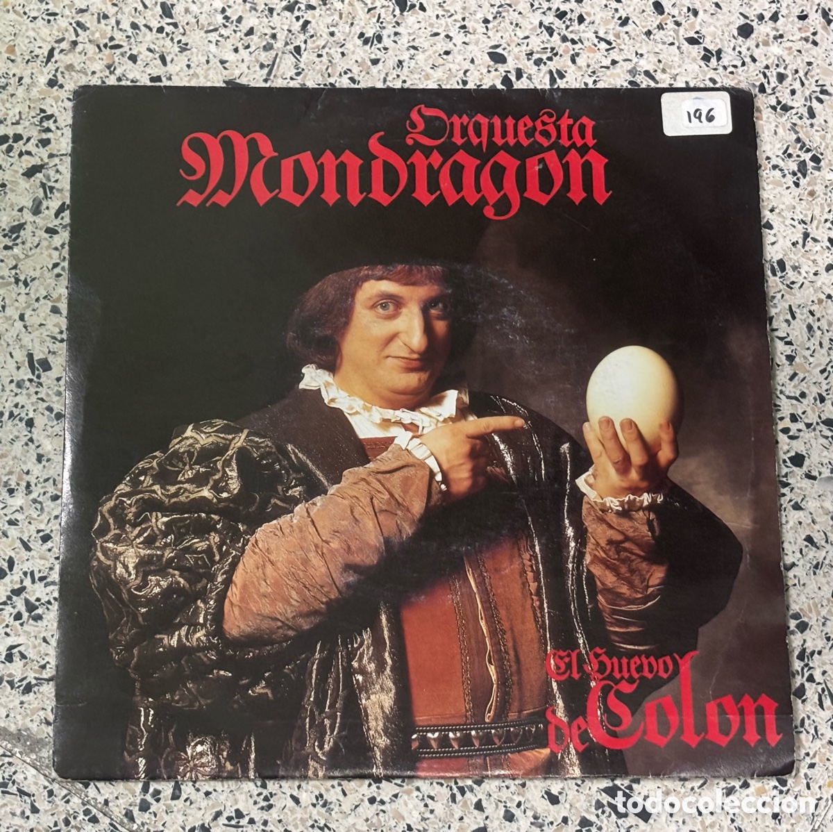Discos de vinilo: Vinilo 7&rdquo; Orquesta Mondrag&oacute;n - El Huevo De Col&oacute;n (1992) DRO Sabina Carmona