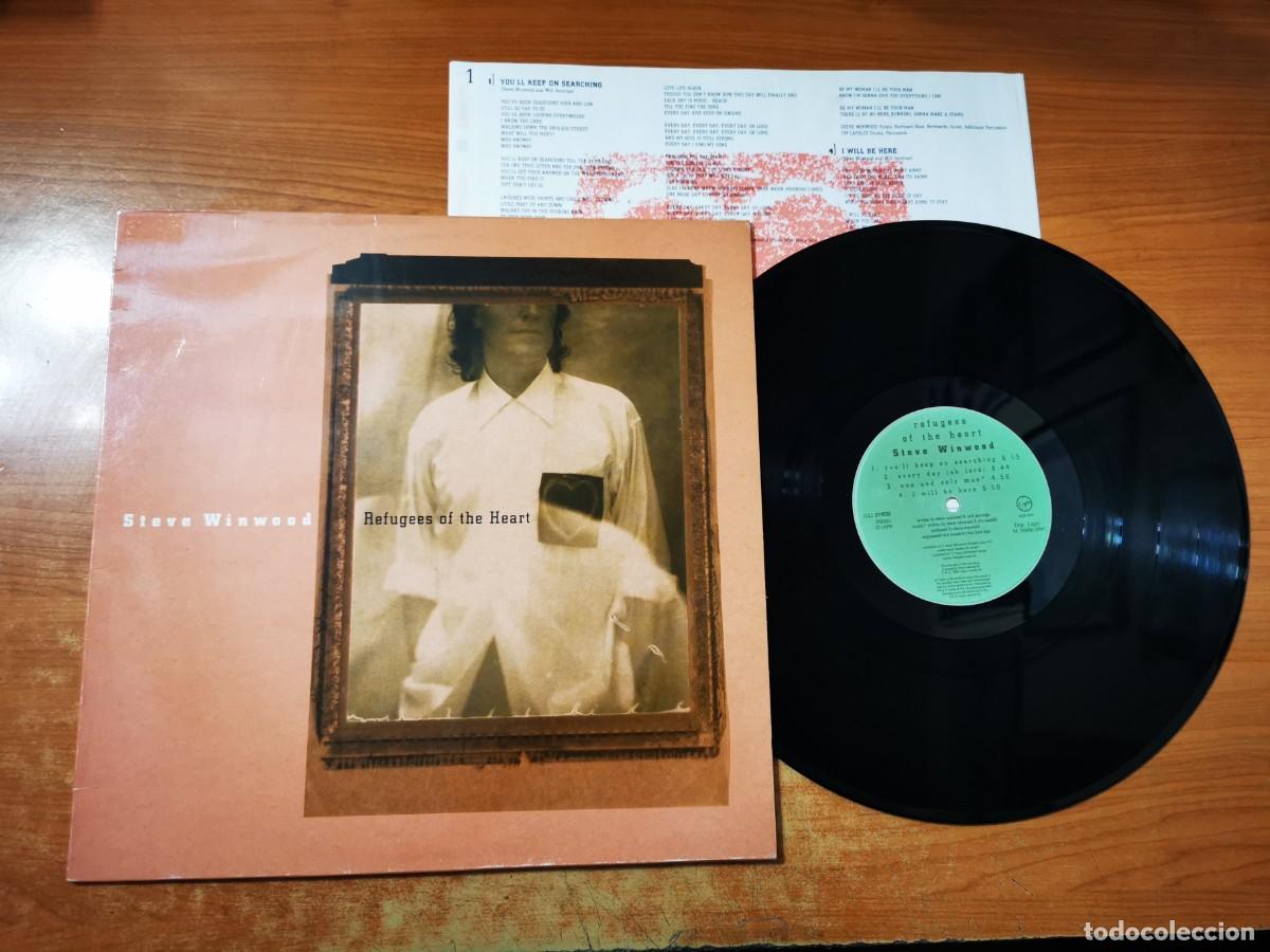 Discos de vinilo: STEVE WINWOOD Refugees of the heart LP VINILO A&Ntilde;O 1990 ESPA&Ntilde;A CON ENCARTE TRAFFIC CONTIENE 8 TEMAS