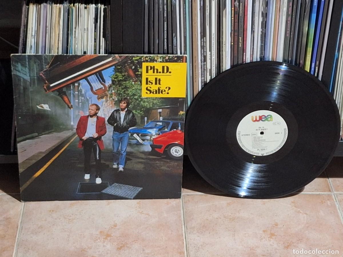 Discos de vinilo: Ph.D. &ndash; Is It Safe? LP WEA &lrm;&ndash; 25.0050-1 GERMANY