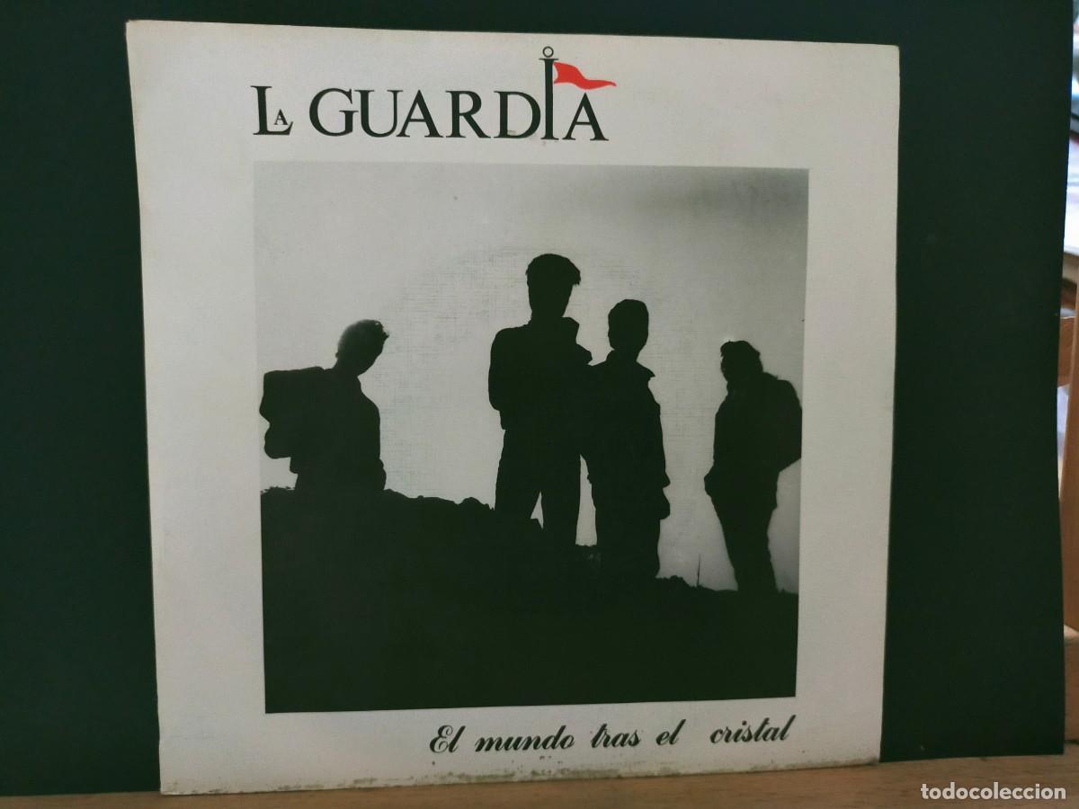 Discos de vinilo: LA GUARDIA. EL MUNDO TRAS EL CRISTAL. ZAFIRO. 2 TEMAS. EL MUNDO TRAS EL CRISTAL- &iexcl;OH! NENA. 1988