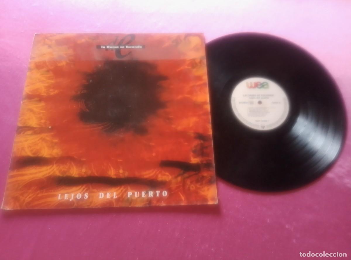 Discos de vinilo: LA DAMA SE ESCONDE LEJOS DEL PUERTO 1990 LP L31 42