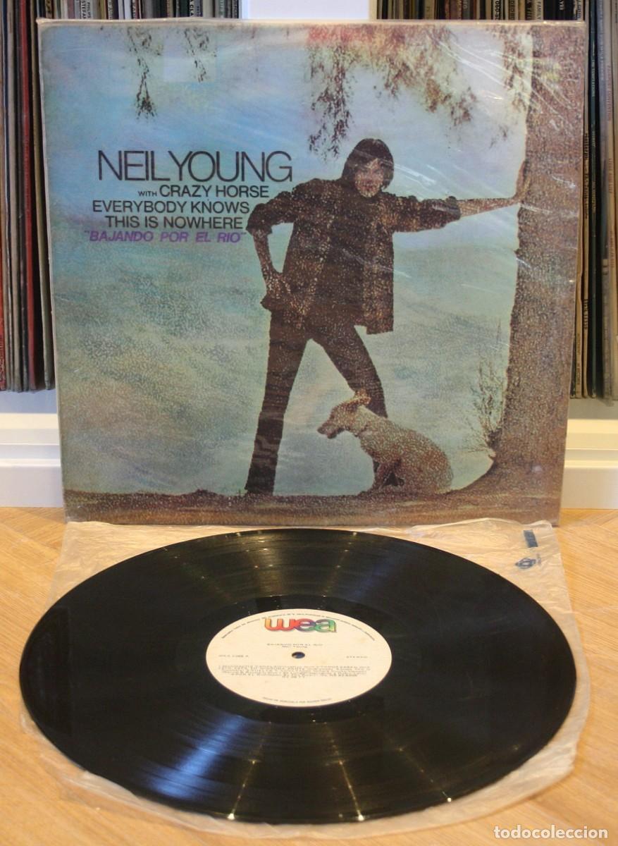 Discos de vinilo: NEIL YOUNG Everybody Knows This Is Nowhere 1988 Venezuela LP Bajando por el Rio