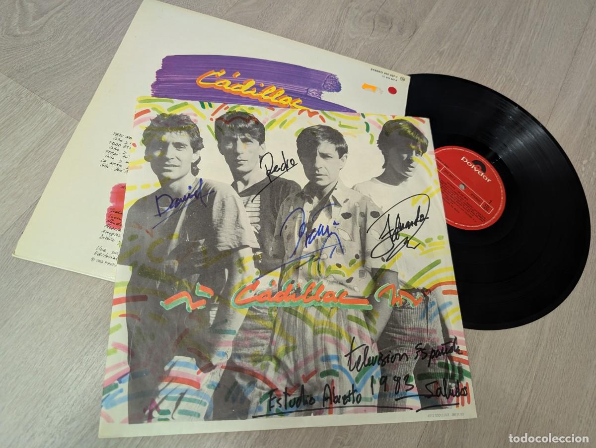 Discos de vinilo: CADILLAC - UN DIA MAS ....LP DE 1983 POLYDOR CON LETRAS .. FIRMADO POR EL GRUPO - BUEN ESTADO