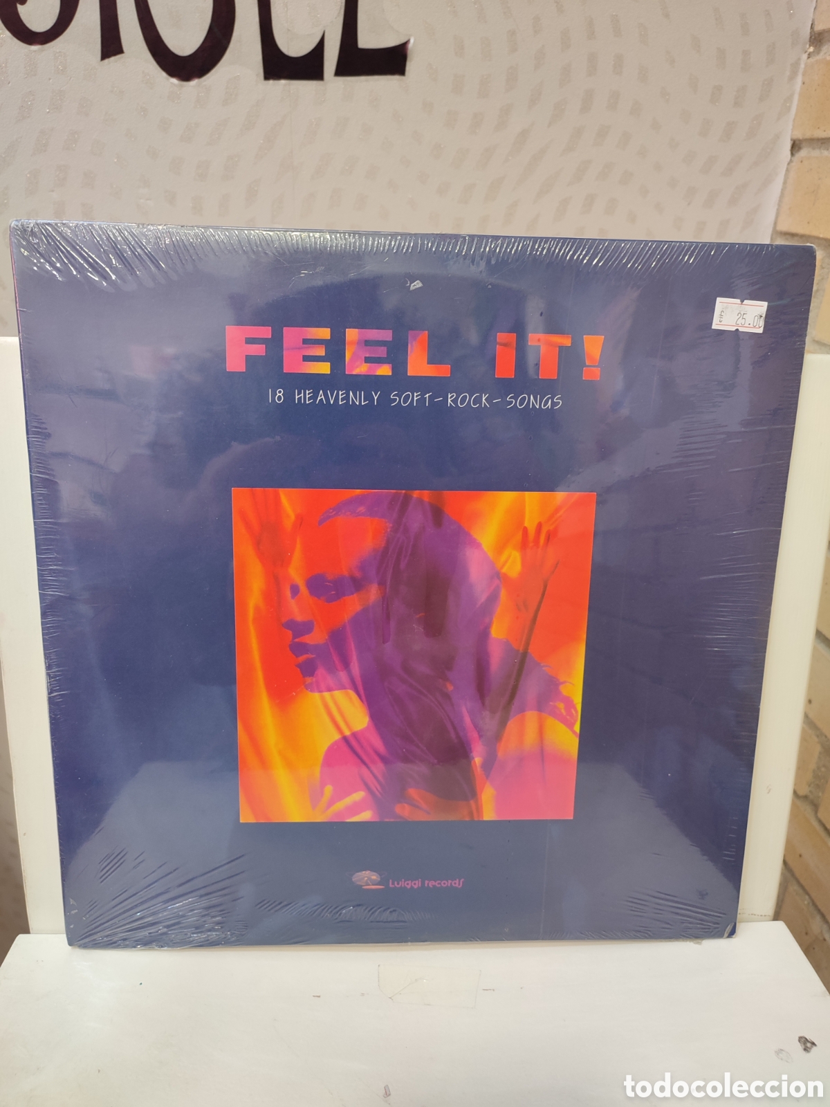 Discos de vinilo: Feel It!. &rdquo; 18 Heavenly Soft-Rock-Songs &rdquo;. Primera Edici&oacute;n Espa&ntilde;ola. 1995. Luiggi R&eacute;cords.