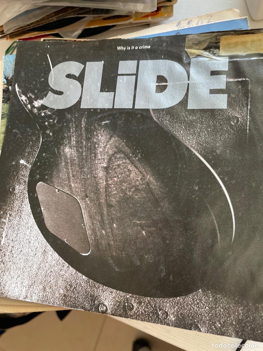 Discos de vinilo: Slide why is it a crime single