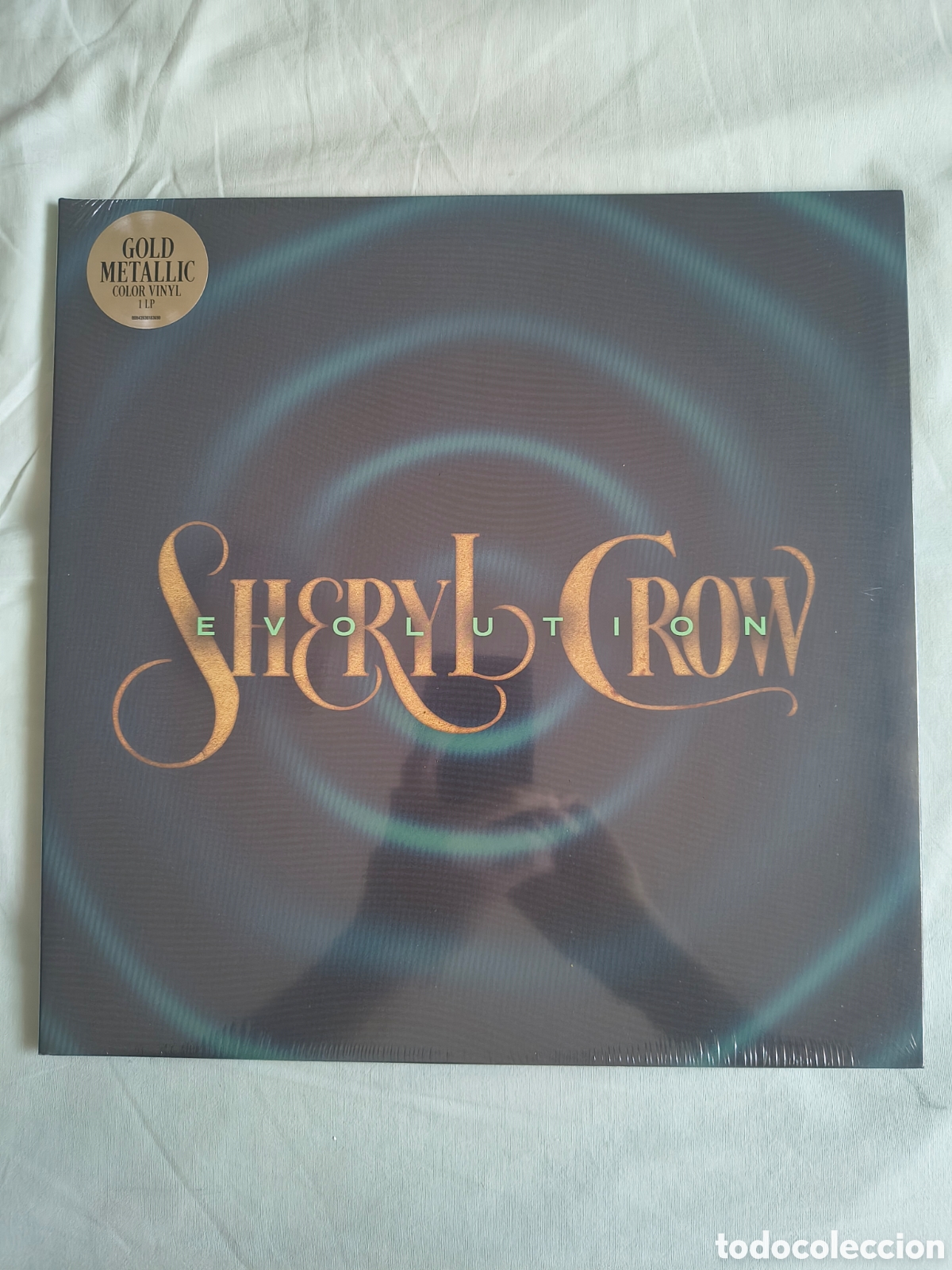 Discos de vinilo: SHERYL CROW EVOLUTION. VINILO LP GOLD METALLIC. NUEVO
