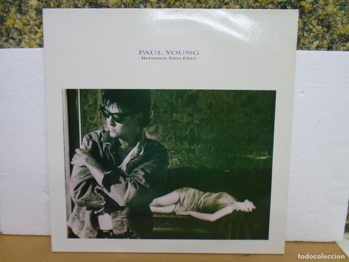 Discos de vinilo: PAUL YOUNG&rdquo;BETWEEN TWO FIRES&rdquo; VINILO CBS 1986.