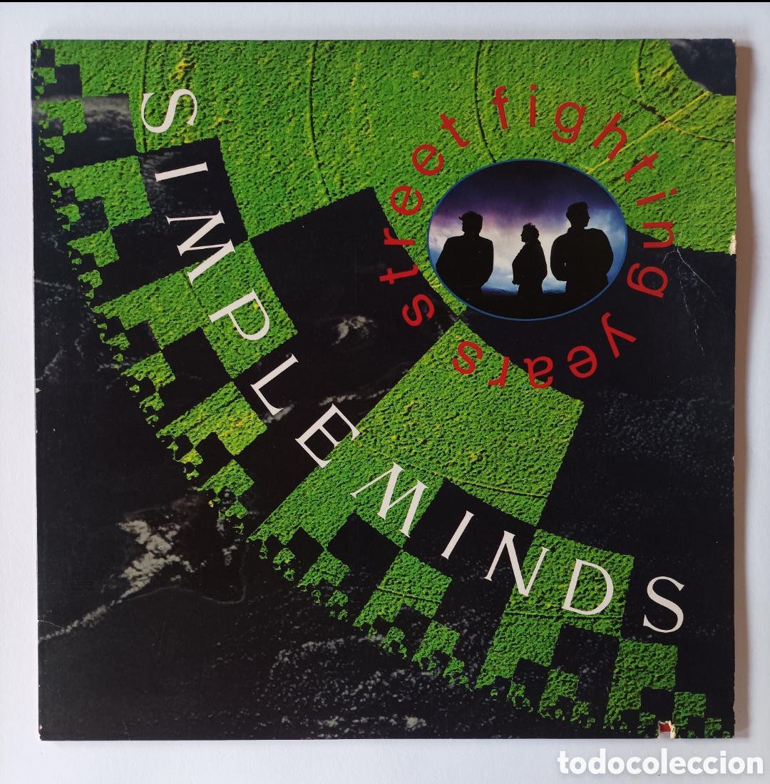 Discos de vinilo: SIMPLE MINDS. STREET FIGHTING YEARS. DISCO VINILO LP. EXCELENTE ESTADO.