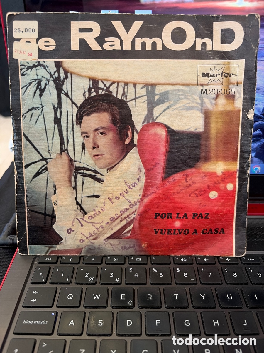 Discos de vinilo: DE RAYMOND - POR LA PAZ + VUELVO A CASA SINGLE FIRMADO POR EL ARTISTA