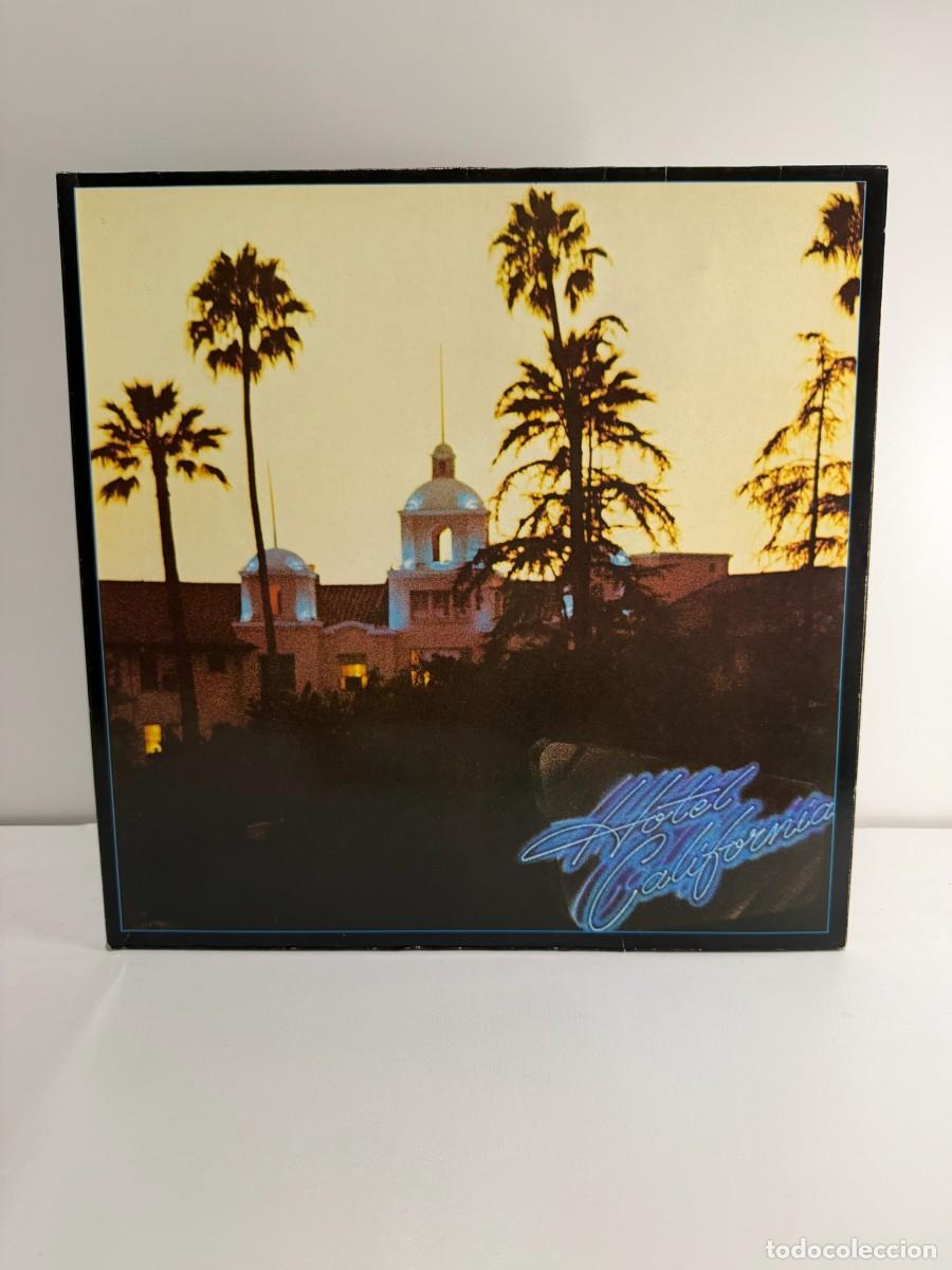 Discos de vinilo: EAGLES (LP) HOTEL CALIFORNIA - A&Ntilde;O 1976 - PORTADA ABIERTA - EDICION ALEMANA - ENCARTE + POSTER