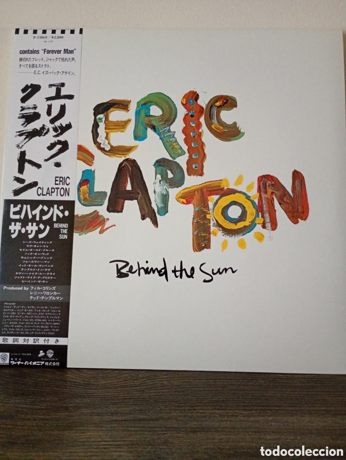 Discos de vinilo: Eric Clapton, Behind the Sun 1985. Made un Japan gatefoul con Obi y stick promocional.