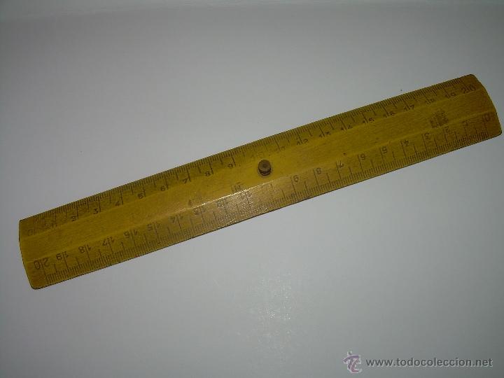 Escriban&iacute;a: ANTIGUA REGLA DE MADERA Y SOPORTE DE LATON. - Foto 1