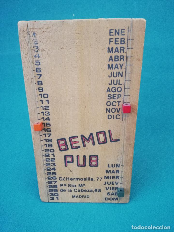 Escriban&iacute;a: CURIOSO CALENDARIO REGULABLE CON PUBLICIDAD - MADERA - Foto 1