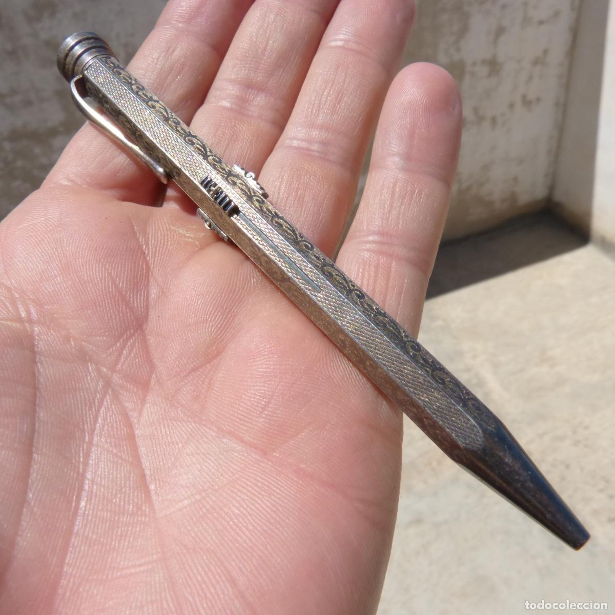 Escriban&iacute;a: Portaminas de metal, 4 colores, sin marca, funciona correctamente. 28,20gr.