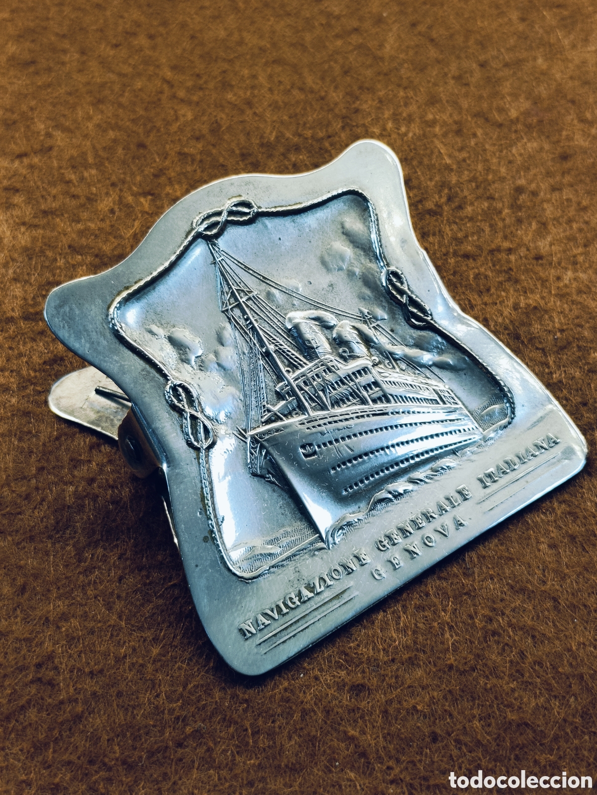 Escriban&iacute;a: ANTIGUA Y RARA PINZA PARA DOCUMENTOS . NAVEGACION GENERAL ITALIANA . GENOVA. METAL PLATEADO