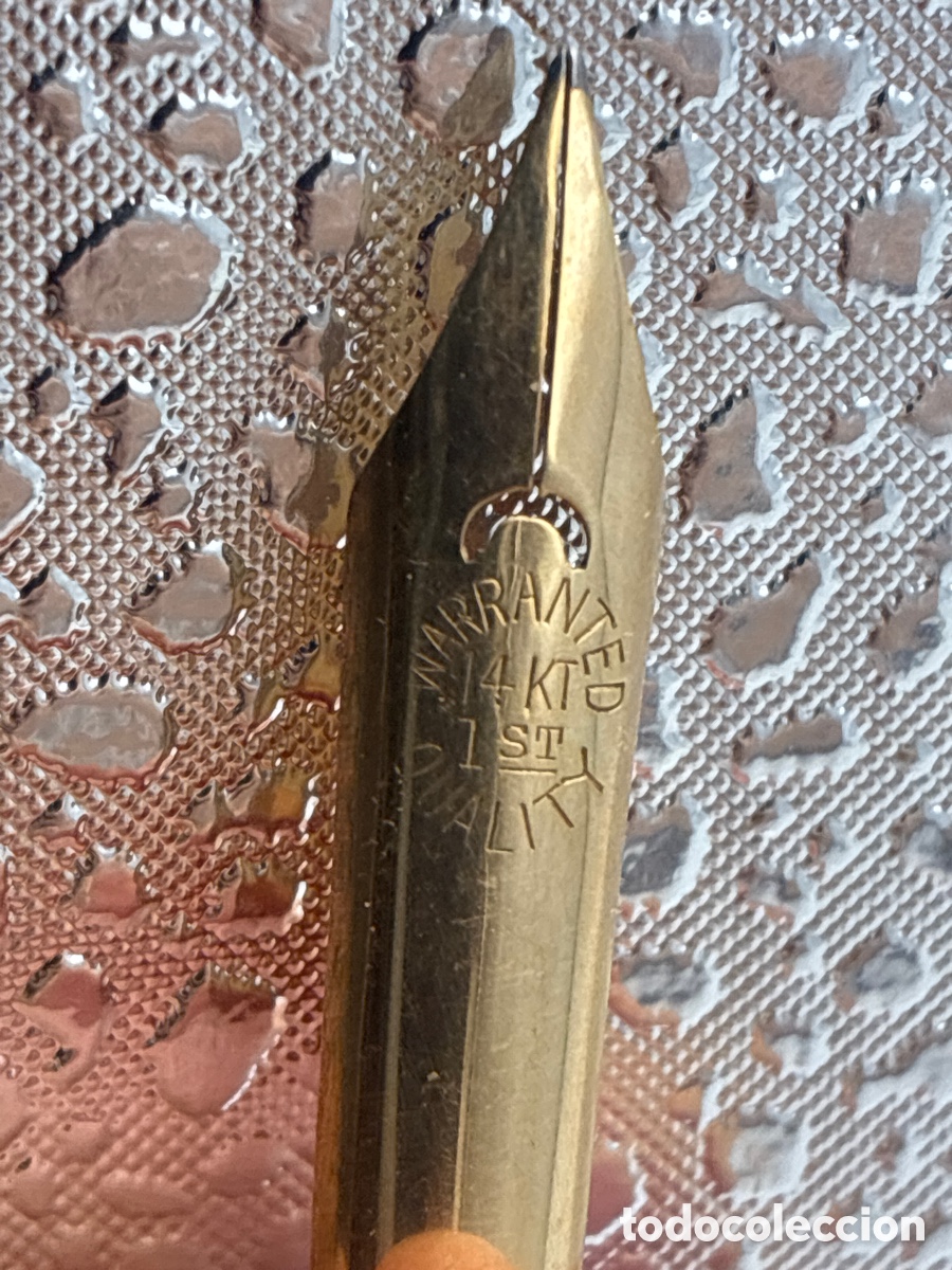 Escriban&iacute;a: Plum&iacute;n de oro 14k de 36 mm de longitud.
