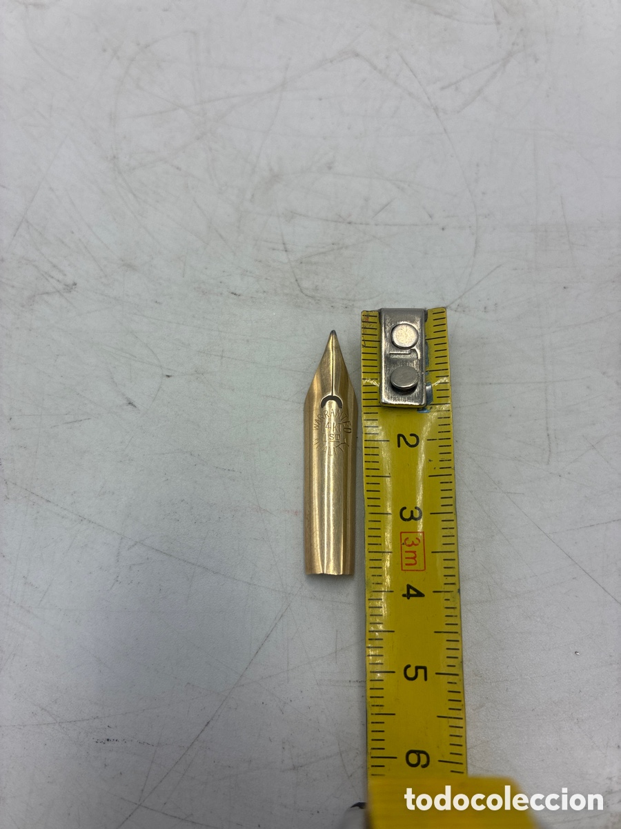 Escriban&iacute;a: Plum&iacute;n de oro 14k de 36 mm de longitud.
