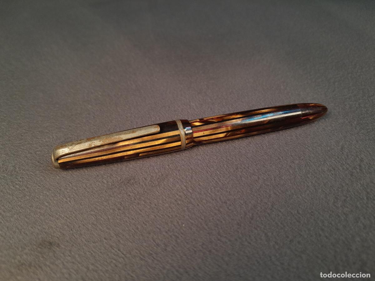 Plumas estilogr&aacute;ficas antiguas: PLU-280.PLUMA ESTILOGR&Aacute;FICA VINTAGE EN CELULOIDE ESTRIADO MARR&Oacute;N CON PLUM&Iacute;N DE ORO MACIZO.MITAD S.XX
