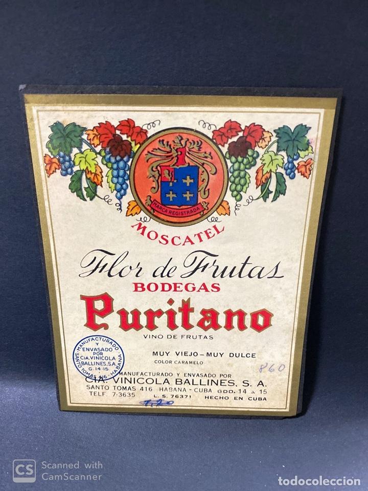 Alte Etiketten: ETIQUETA DE VINO. CUBA. HABANA. BODEGA PURITANO. MOSCATEL. FLOR DE FRUTAS. VINICOLA BALLINES.