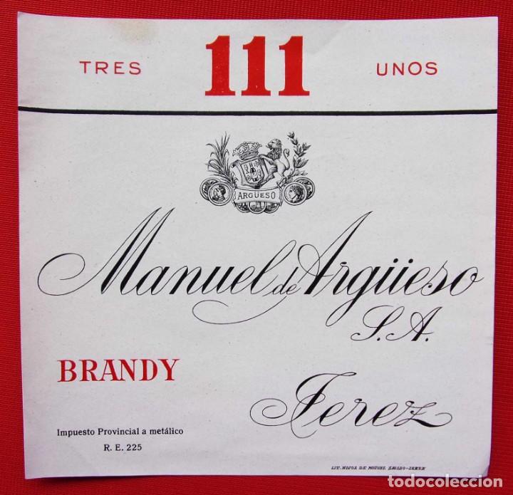 Etiquetas antiguas: ANTIGUA ETIQUETA. BRANDY.TRES UNOS. 111. MANUEL DE ARG&Uuml;ESO S.A. JEREZ. BUEN ESTADO. NUNCA PEGADA.