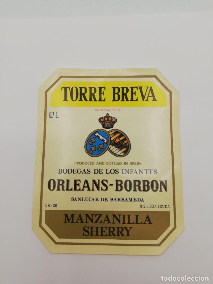 Alte Etiketten: ETIQUETA. TORRE BREVA. BODEGAS DE LOS INFANTES ORLEANS-BORBON. MANZANILLA SHERRY. SANLUCAR BARRAMEDA