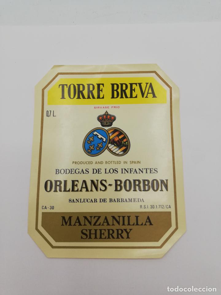 Alte Etiketten: ETIQUETA. TORRE BREVA. BODEGAS DE LOS INFANTES ORLEANS-BORBON. MANZANILLA SHERRY. SANLUCAR BARRAMEDA