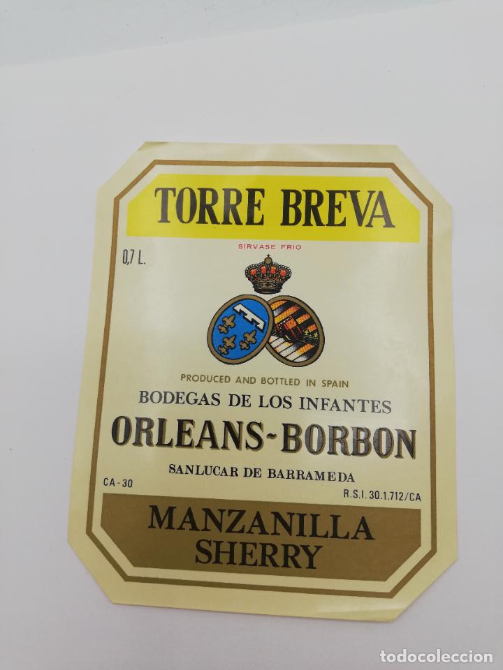 Alte Etiketten: ETIQUETA. TORRE BREVA. BODEGAS DE LOS INFANTES ORLEANS-BORBON. MANZANILLA SHERRY. SANLUCAR BARRAMEDA