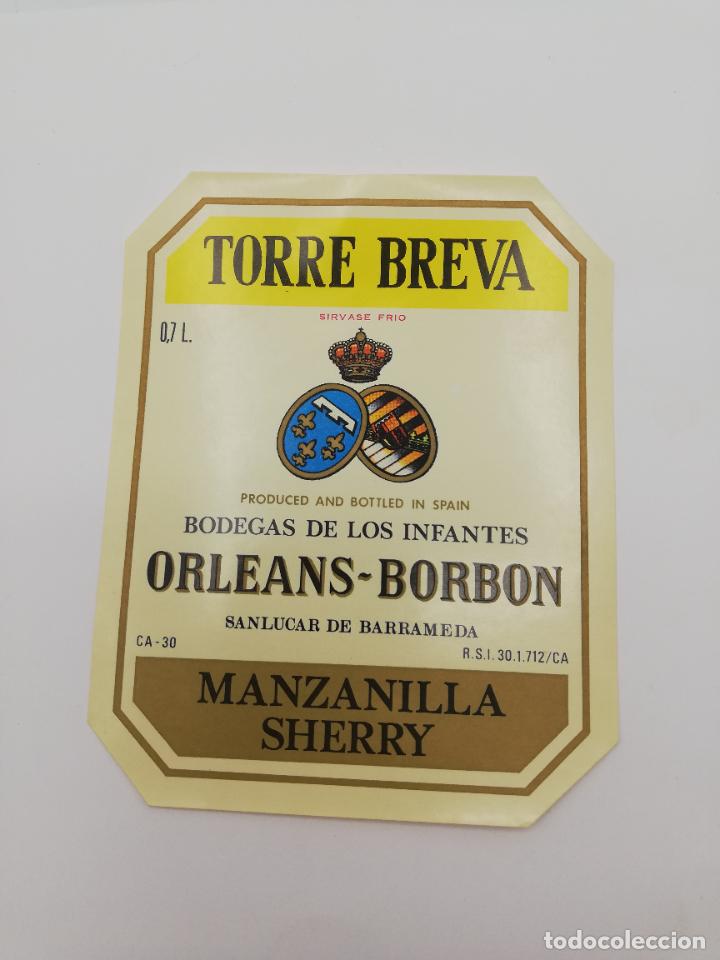 Alte Etiketten: ETIQUETA. TORRE BREVA. BODEGAS DE LOS INFANTES ORLEANS-BORBON. MANZANILLA SHERRY. SANLUCAR BARRAMEDA
