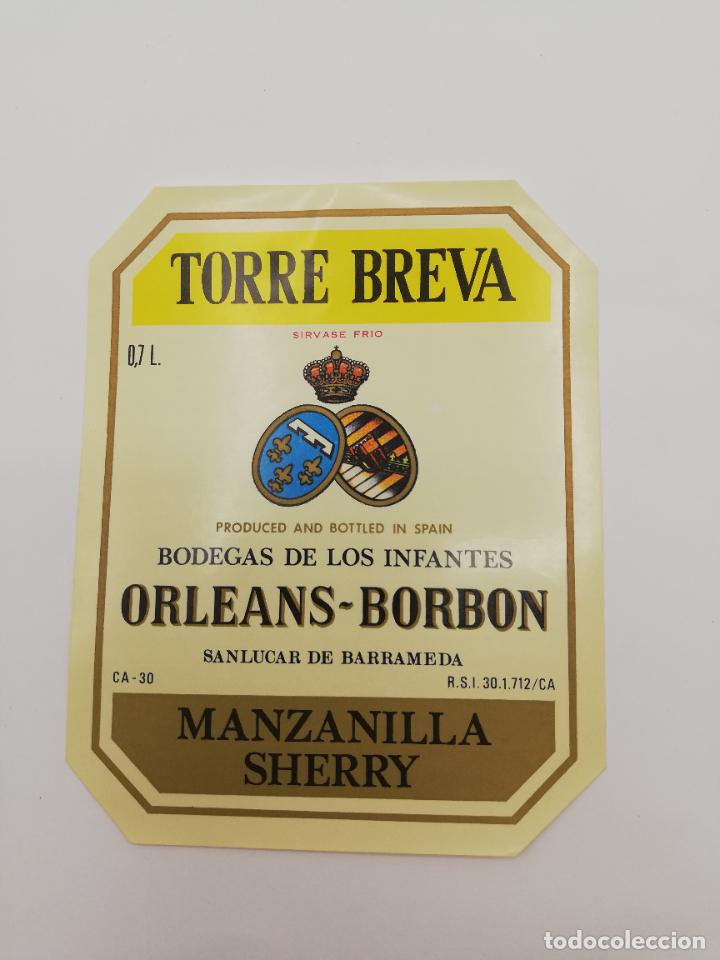 Alte Etiketten: ETIQUETA. TORRE BREVA. BODEGAS DE LOS INFANTES ORLEANS-BORBON. MANZANILLA SHERRY. SANLUCAR BARRAMEDA