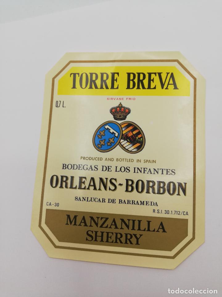Alte Etiketten: ETIQUETA. TORRE BREVA. BODEGAS DE LOS INFANTES ORLEANS-BORBON. MANZANILLA SHERRY. SANLUCAR BARRAMEDA