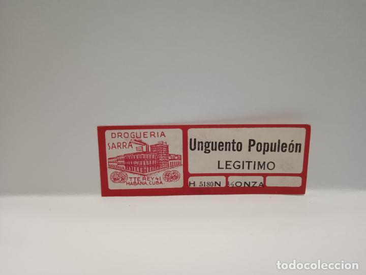 Alte Etiketten: ETIQUETA. DROGUERIA SARRA. UNGUENTO POPULEON. LEGITIMO. MEDIDAS : 6.5 X 2.5 CM APROX.