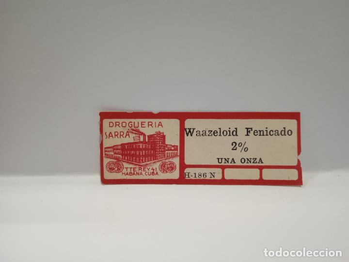 Alte Etiketten: ETIQUETA. DROGUERIA SARRA. WAAZELPOID FENICADO 2% UNA ONZA. MEDIDAS : 6.5 X 2.5 CM APROX.