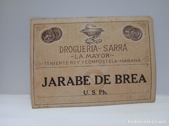 Alte Etiketten: ETIQUETA. DROGUERIA SARRA. JARABE DE BREA. MEDIDAS : 9 X 7 CM APROX.