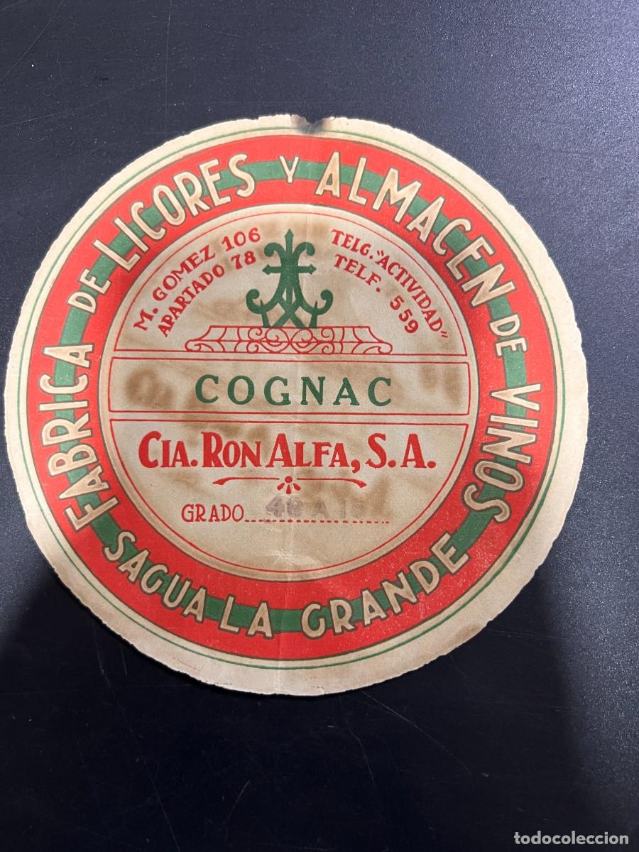 Etichette antiche: ETIQUETA. CUBA. CO&Ntilde;AC. CIA. RON ALFA, S.A. F&Aacute;BRICA DE LICORES Y ALMAC&Eacute;N DE VINOS. SAGUA LA GRANDE