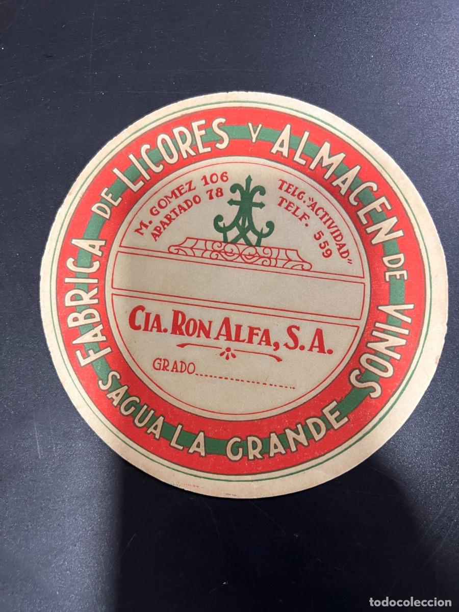 Etichette antiche: ETIQUETA. CUBA. COMPA&Ntilde;&Iacute;A RON ALFA, S.A. F&Aacute;BRICA DE LICORES Y ALMAC&Eacute;N DE VINOS. SAGUA LA GRANDE