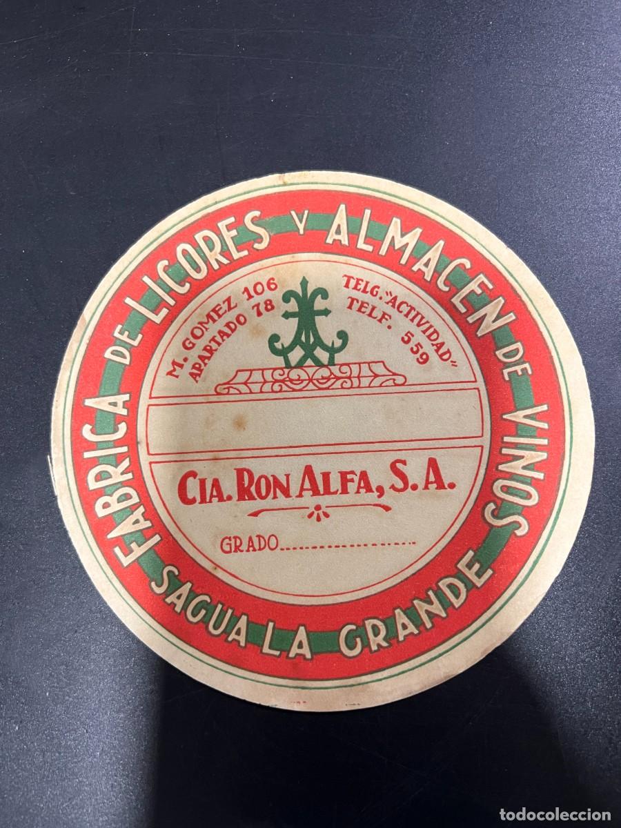 Etichette antiche: ETIQUETA. CUBA. COMPA&Ntilde;&Iacute;A RON ALFA, S.A. F&Aacute;BRICA DE LICORES Y ALMAC&Eacute;N DE VINOS. SAGUA LA GRANDE