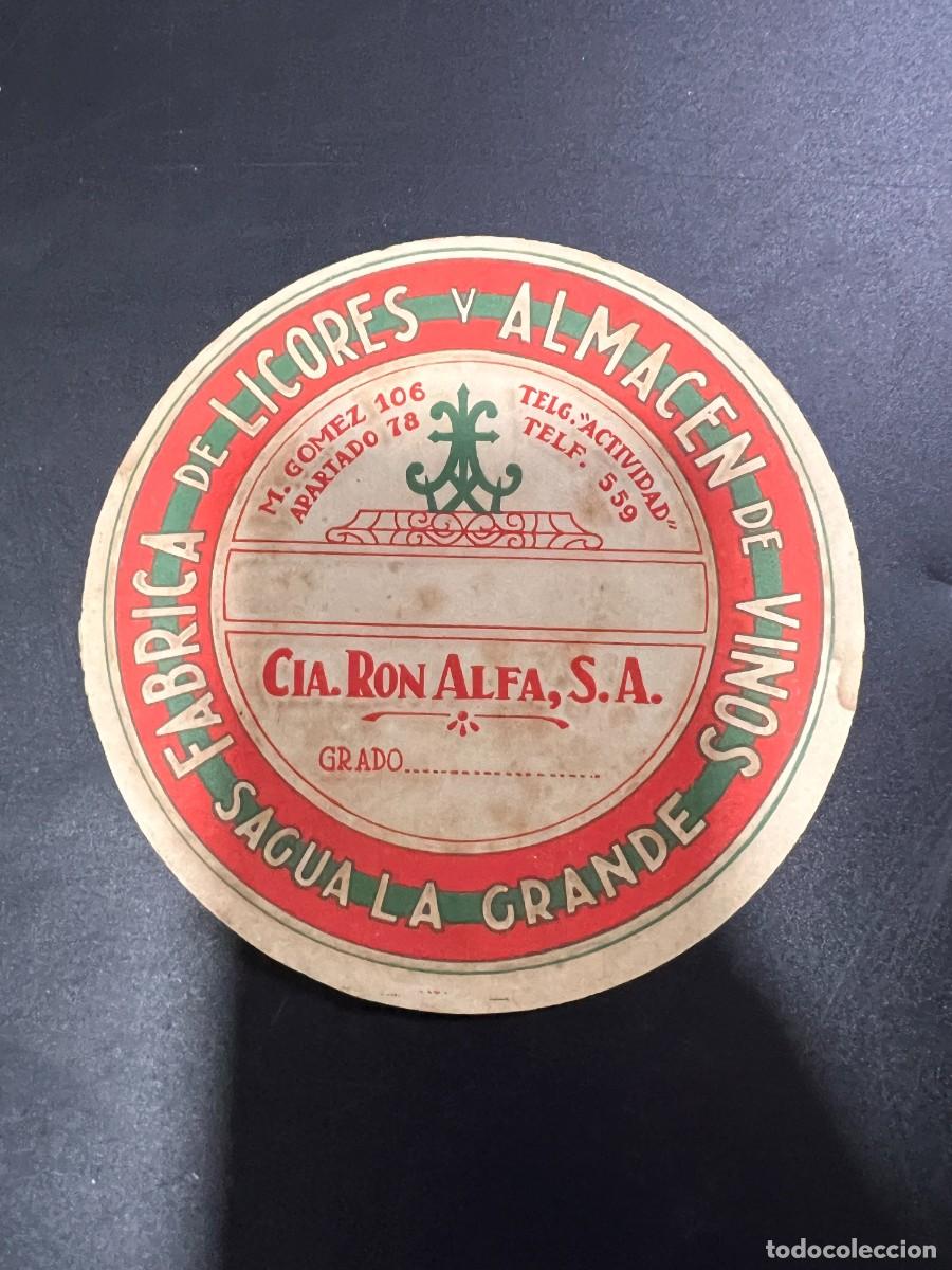 Etichette antiche: ETIQUETA. CUBA. COMPA&Ntilde;&Iacute;A RON ALFA, S.A. F&Aacute;BRICA DE LICORES Y ALMAC&Eacute;N DE VINOS. SAGUA LA GRANDE