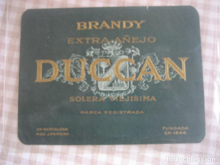 Etiquetas antiguas: Brandy Duccan. Hija de J. Parera. Barcelona. 10 x 13 cm.