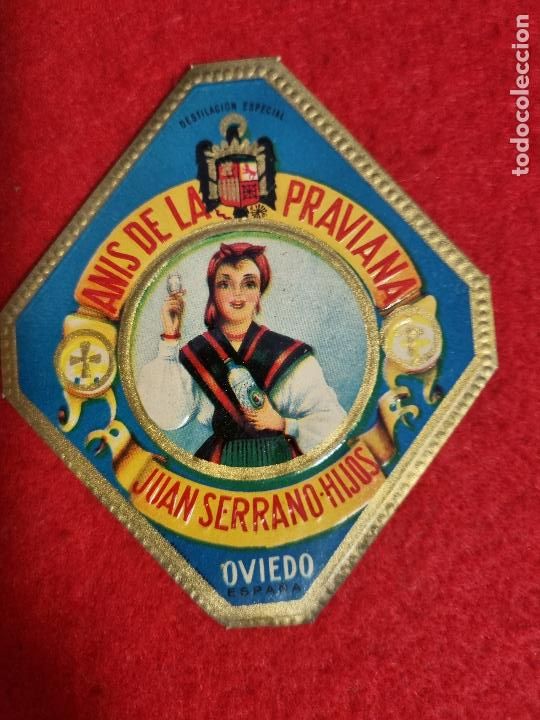 Etichette antiche: ANTIGUA ETIQUETA ANIS LA PRAVIANA JUAN SERRANO HIJOS OVIEDO ASTURIAS RELIEVE MEDIANA ORIGINAL ER 465