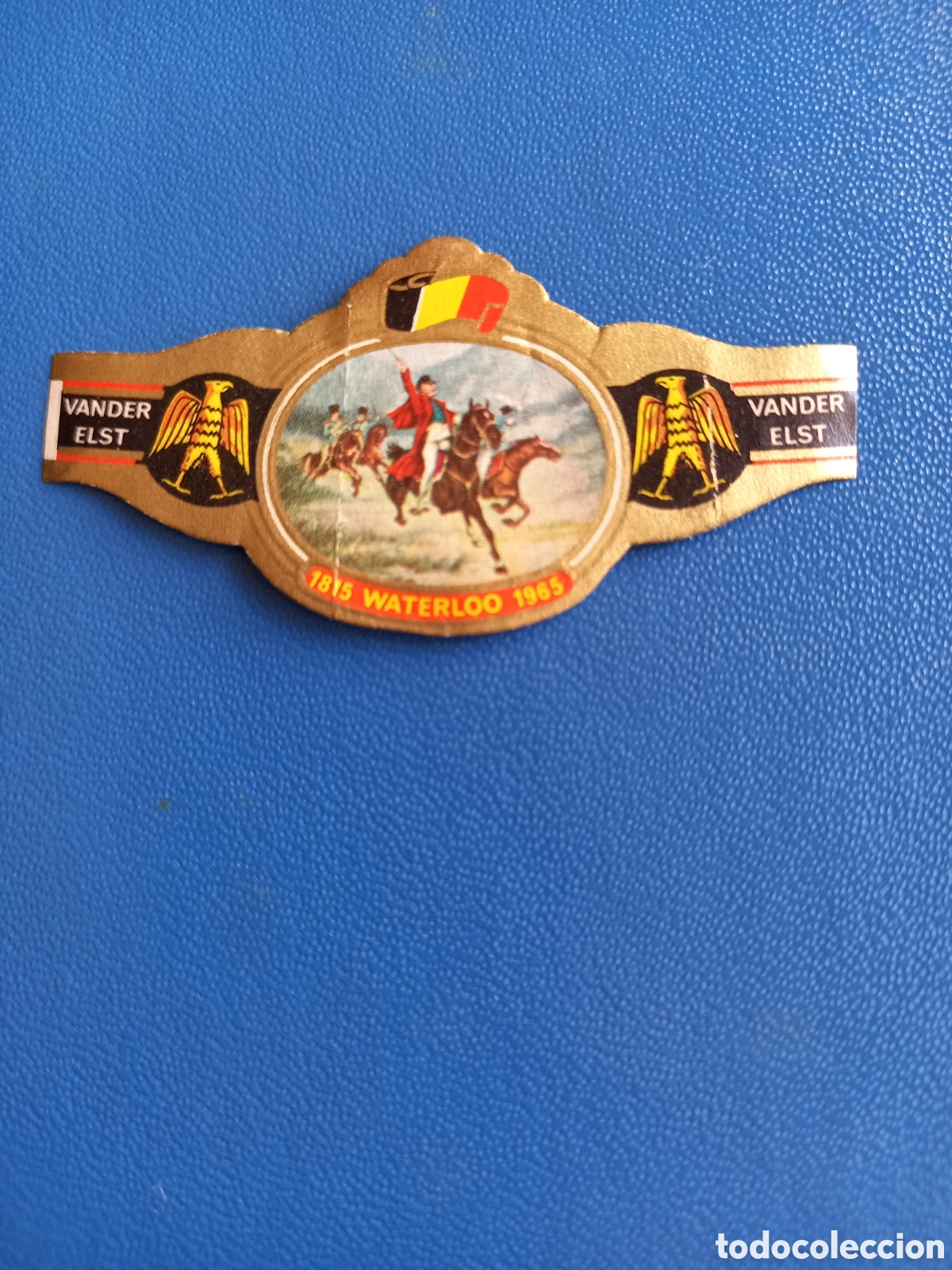 Etiquetas antiguas: VITOLA VANDER ELST - N&deg;10 SERIE 1815 WATERLOO 1965, EN BATALLA. 6x3 cm
