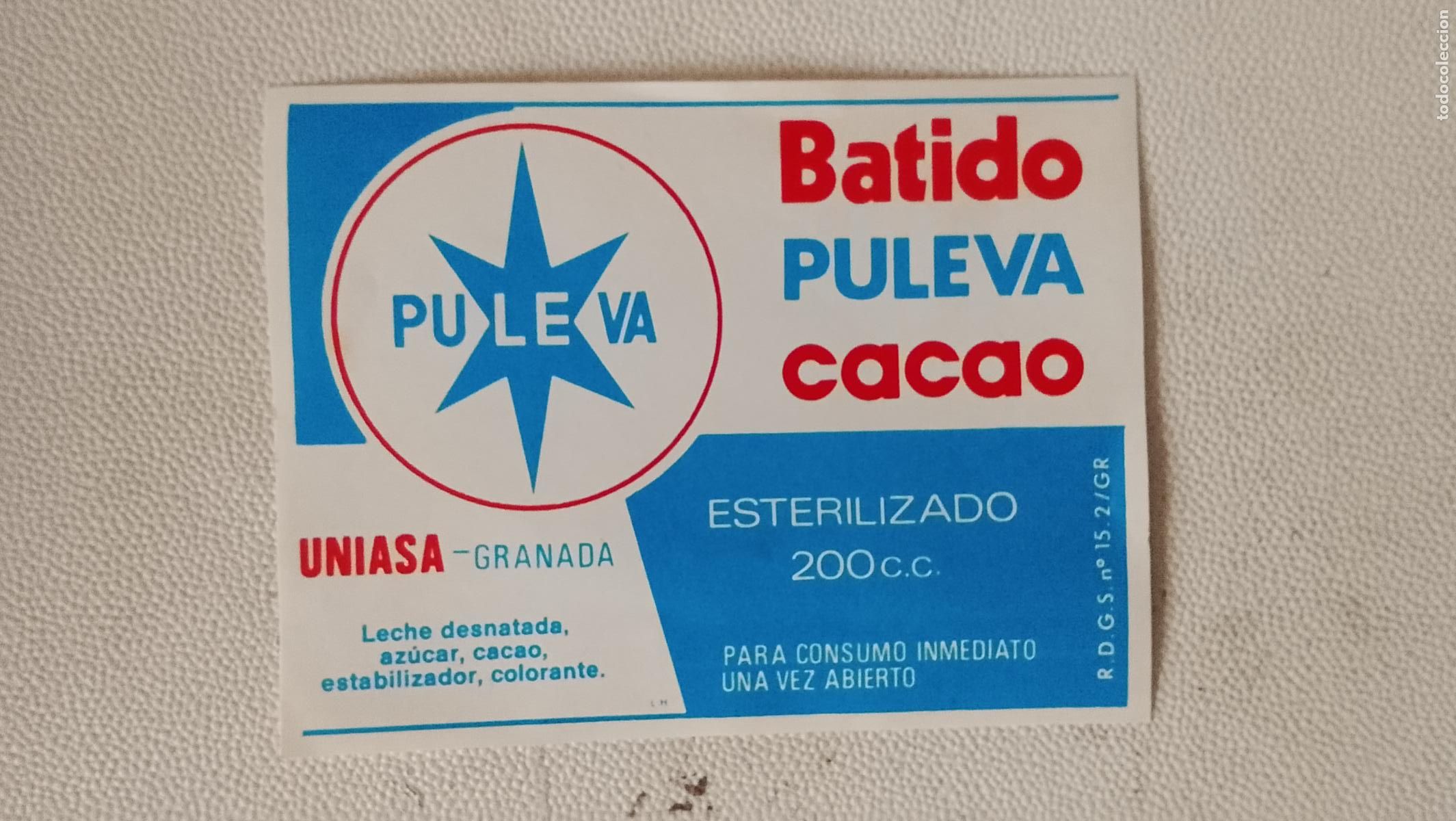 Etiquetas antiguas: antigua etiqueta original BOTELLA LACTEOS LECHE O BATIDOS PULEVA NATA CACAO uniasa granada 200 cc