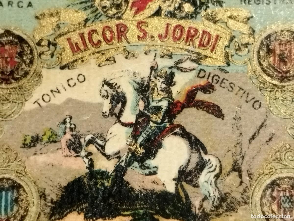 Etiquetas antiguas: ETIQUETA LICOR S. JORDI. TONICO DIGESTIVO. DESTILERIAS LLAD&Oacute;. ARENYS DE MUNT 4 x 3.5 cm