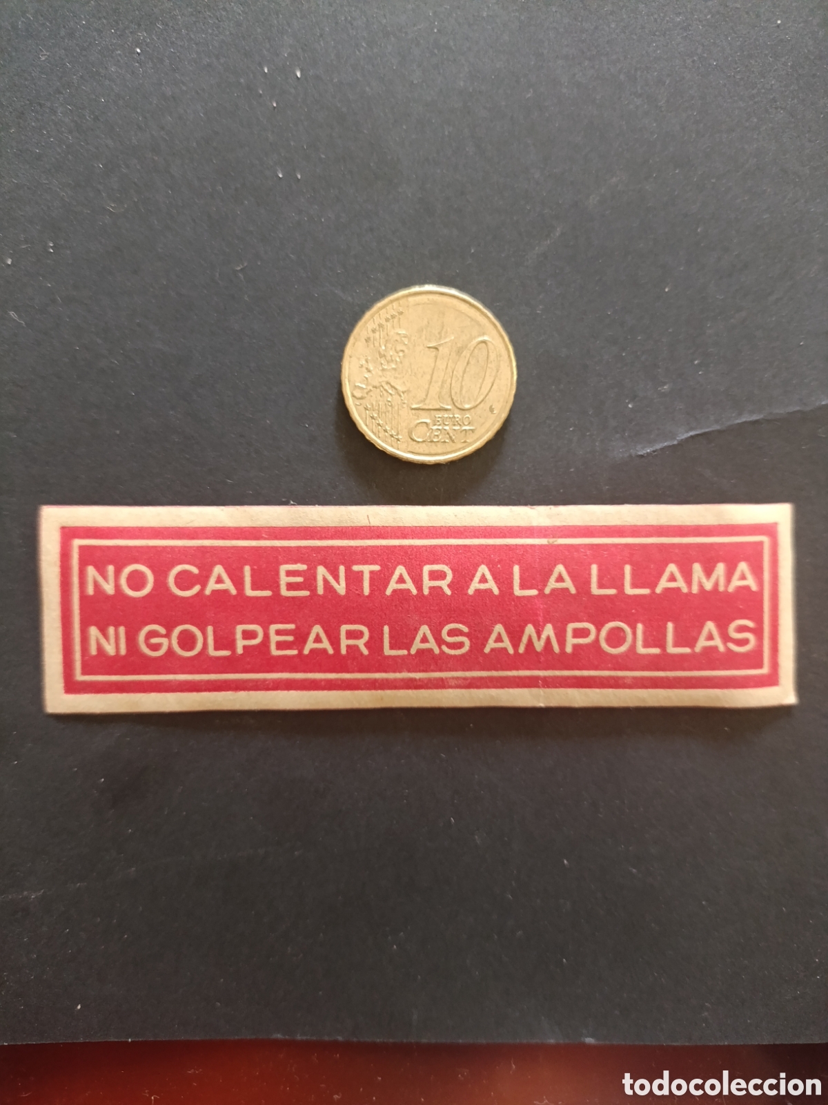 Etiquetas antiguas: NO CALENTAR A LA LLAMA NI GOLPEAR LAS AMPOLLAS [ ETIQUETAS A&Ntilde;OS 40-50 ]