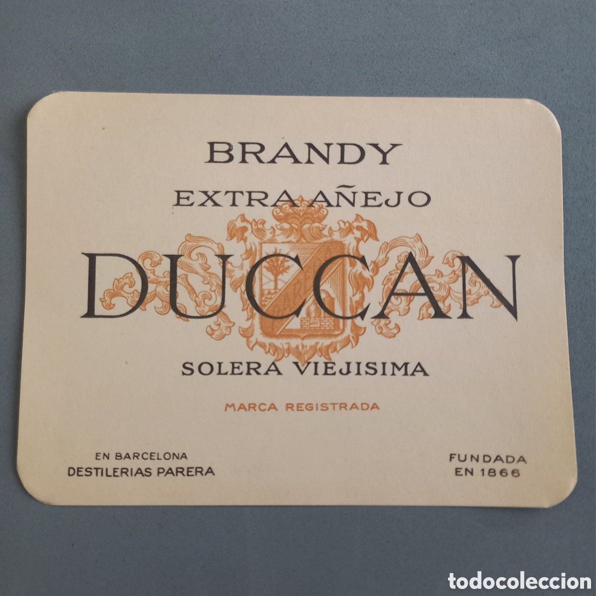 Etiquetas antiguas: Antigua etiqueta de Brandy Extra A&ntilde;ejo DUCCAN de Destiler&iacute;as Juan Parera, Barcelona, a&ntilde;os 50 - 60