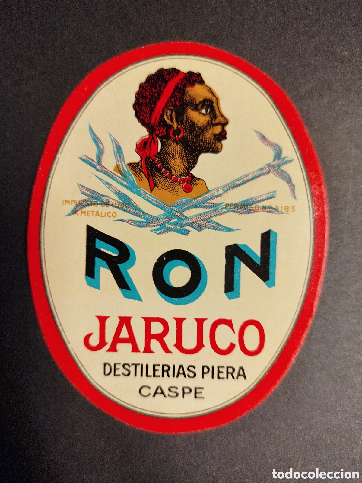 Etiquetas antiguas: ETIQUETA RON JARUCO DESTILER&Iacute;AS CASPE