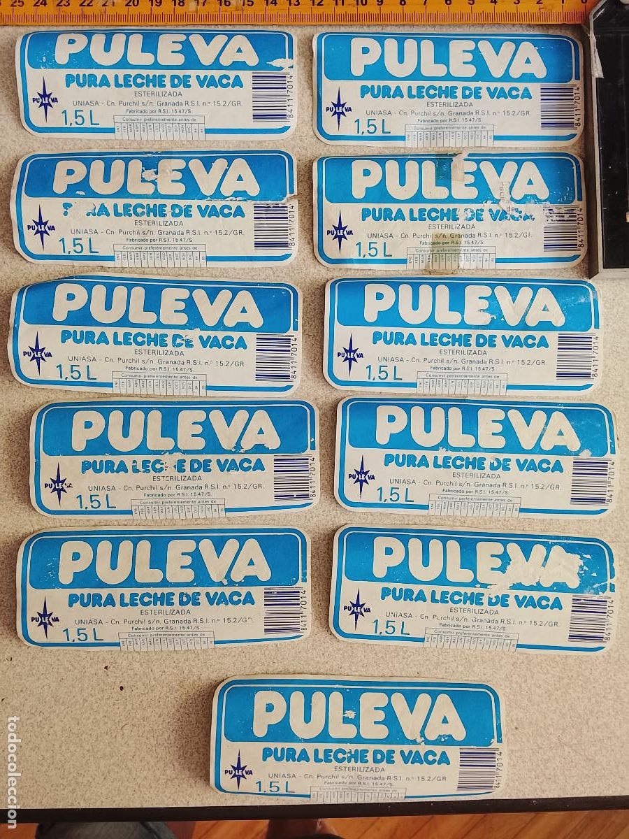 Etiquetas antiguas: LOTE DE 11 ETIQUETAS ORIGINALES DE 1,5 LITROS UNIASA LACTEOS LECHE PULEVA DE LOS A&Ntilde;OS 80 - 1984 1985
