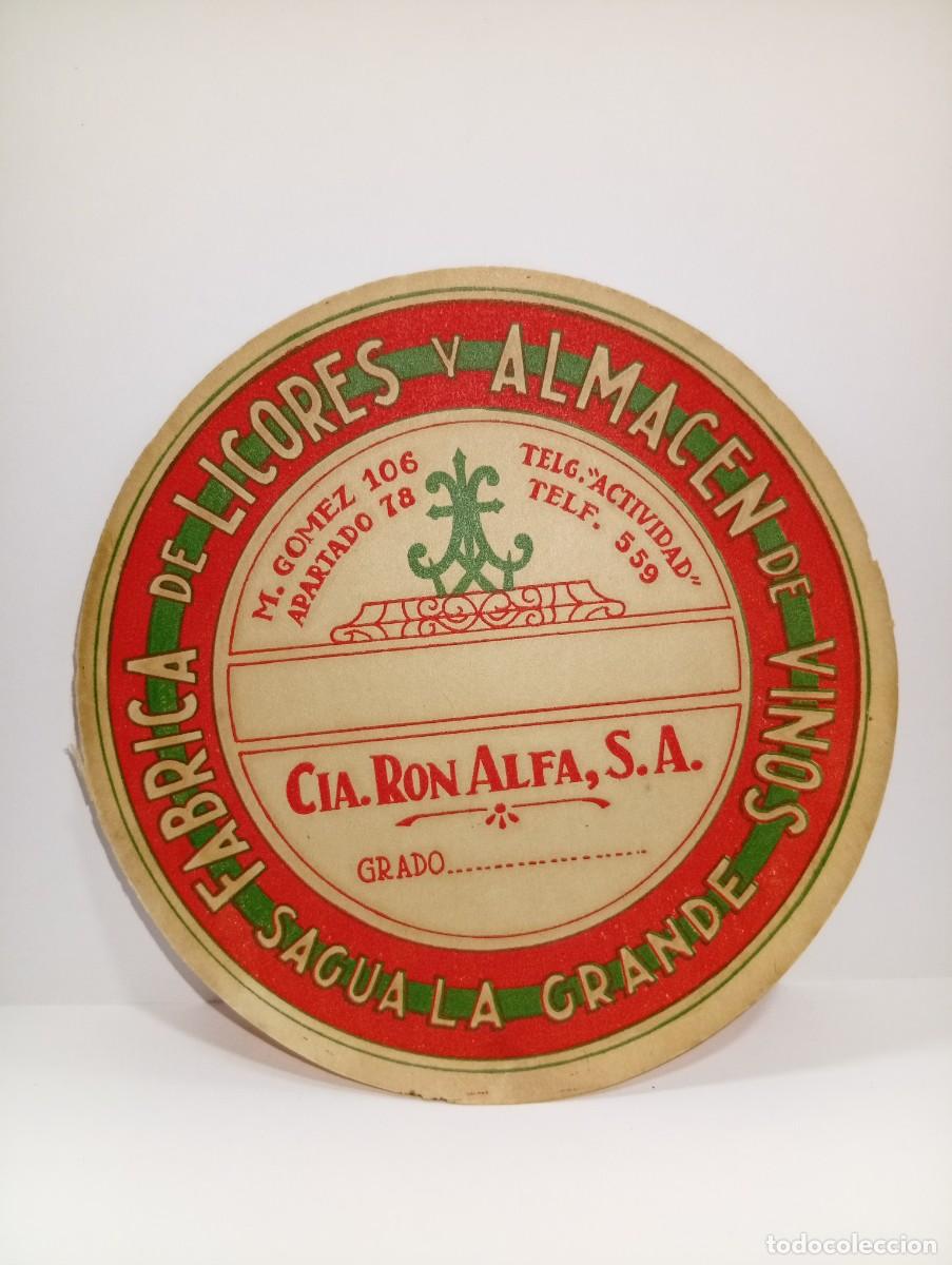 Etiquetas antiguas: ETIQUETA. F&Aacute;BRICA DE LICORES Y ALMACEN DE VINOS. SAGUA LA GRANDE. RON ALFAL. MED : 13 X 13 CM APROX.